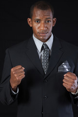 Handsome businessman in a fighting pose
