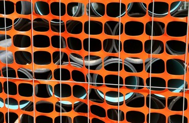 construction site  with Safety Fence Barrier and the big pipes t