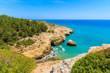 Fototapeta premium Secluded sea bay with rocky cliffs on coast of Algarve region, Portugal