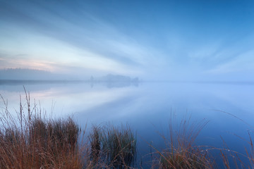 mist and cloudscape on wild lake