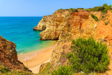 Cliff rocks on beautiful beach near Portimao town, Algarve region, Portugal
