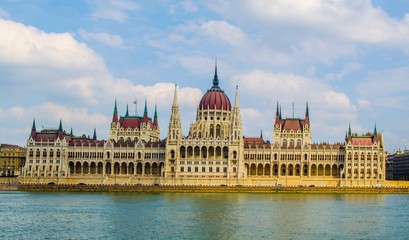 View over building of hungarian parliament in budapest taken from opposite shore of danube river