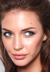 Close up portrait of beautiful young woman face. Isolated on