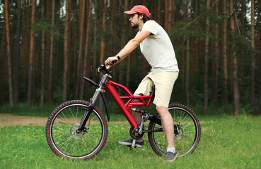 Fototapeta premium Sport, leisure and healthy lifestyle concept - young handsome be