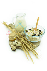 Healthy breakfast - milk with muesli, eggs and honey - health and diet concept