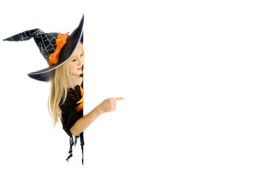 Little witch holding a sign