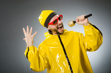 Man wearing yellow suit with mic