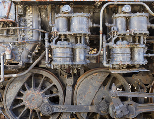 steam-punk style background detail of old steam train engine with rust and damage
