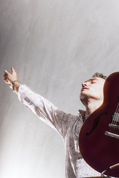 Praise and Worship Concepts. Young Caucasian Male Guitar Player