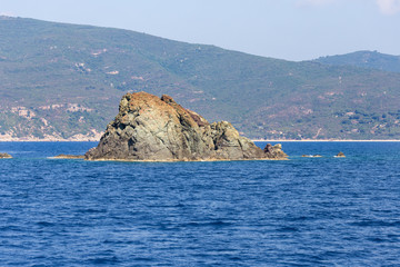 rock in the blue sea
