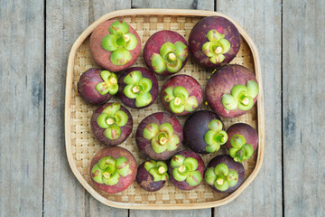 Mangosteen thai fruit on wood background