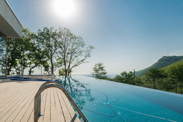 Infinity pool on the bright summer day