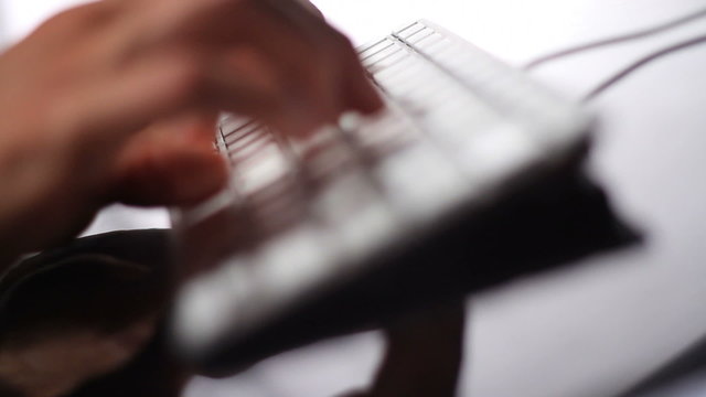 Close up shallow DOF hands typing