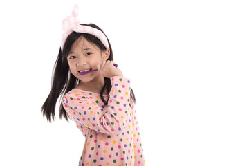 Beautiful asian girl brushing teeth