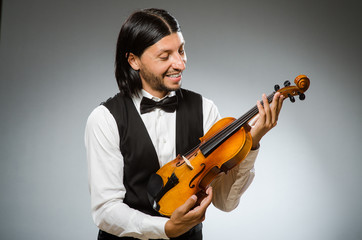 Man playing violin in musical concept
