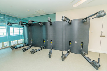 Fototapeta na wymiar Modern gym with various sports equipment
