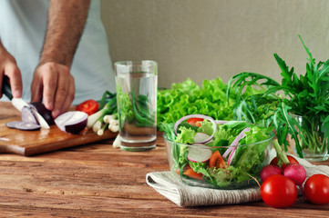 Fresh salad of summer vegetables in a deep bowl of glass