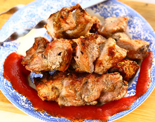 shashlik plate with skewer on the kitchen board