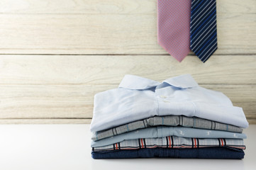 Stack of men shirts with tie