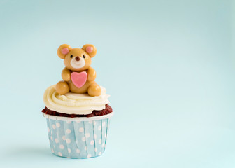 Bear cupcake on blue background