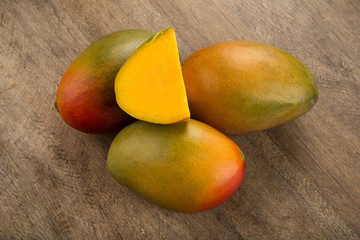 mango on a wood background.
