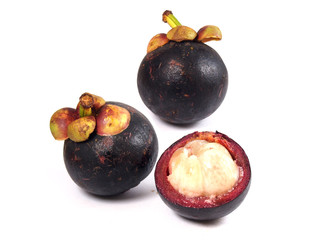 Naklejka na ściany i meble Mangosteen and cross section showing the thick purple skin and white flesh of the queen of friuts
