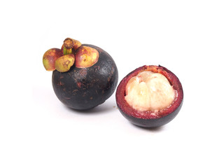 Naklejka na ściany i meble Mangosteen and cross section showing the thick purple skin and white flesh of the queen of friuts