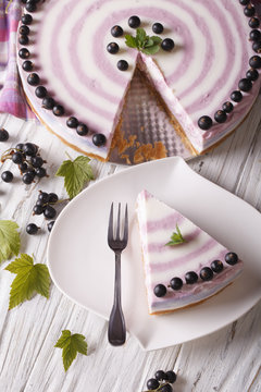 sliced cheese cake with currants close-up. vertical top view
