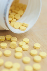 Medicine spilling out of a bottle