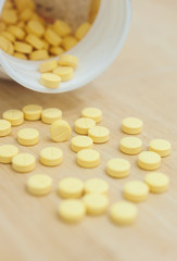 Medicine spilling out of a bottle