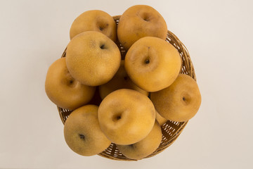 Some asian pears over a wooden surface