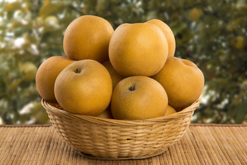 Some asian pears over a wooden surface