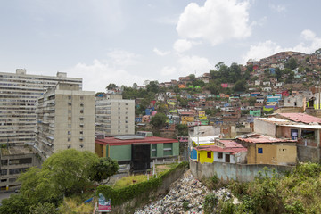 Slum district of Caracas with small wooden coloured houses