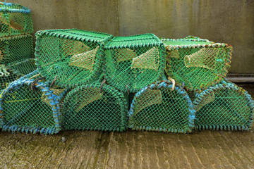 Close up of many lobster cages with a vintage process.