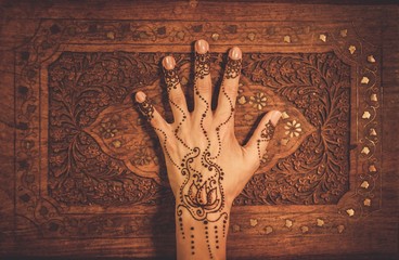 Woman's hand with traditional menhdi henna ornament