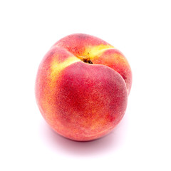 Fototapeta na wymiar Bright juicy peach on a white background