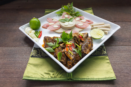 fusion menu fried fish and chilli sauce decorated with Vietnamese ham and sliced fermented pork sausage