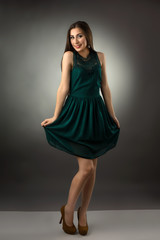 Full length portrait of a young fashionable woman