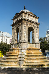 Fototapeta na wymiar Paris - The Fontaine des Innocents is a monumental public fountain located on the place Joachim-du-Bellay in the Les Halles district in Paris, France.