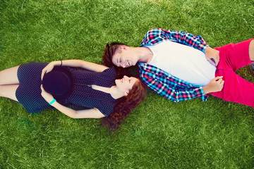 Two young people enjoying on the grass