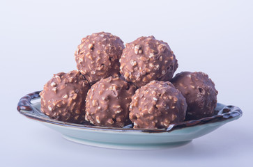 chocolate ball or chocolate bonbon on a background.