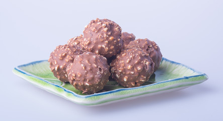 chocolate ball or chocolate bonbon on a background.