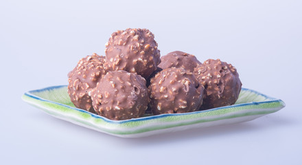 chocolate ball or chocolate bonbon on a background.