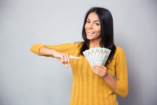 Woman Pointing Finger On Dollar Bills