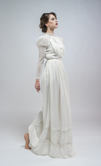 Sexy woman in white long retro dress