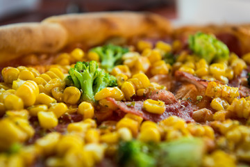 Pizza with salami, sweetcorn and broccoli
