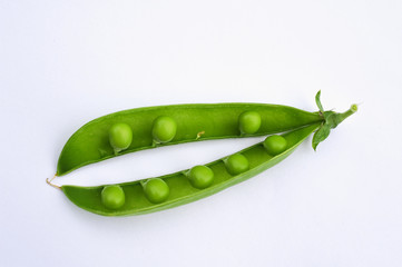  		
the young pod of green peas on a white background