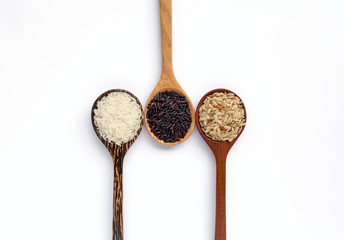 Rice and wooden spoon arrangement on white background