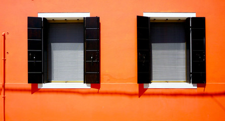 Two Windows House in Burano on orange wall