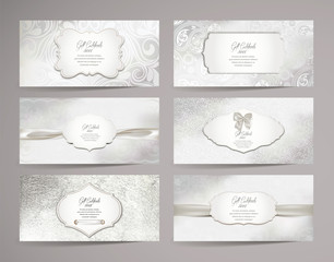 Set of gift certificates with floral design elements and white ribbons